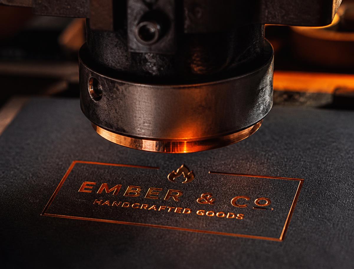 Hot foil press stamping copper foil into charcoal cotton paper